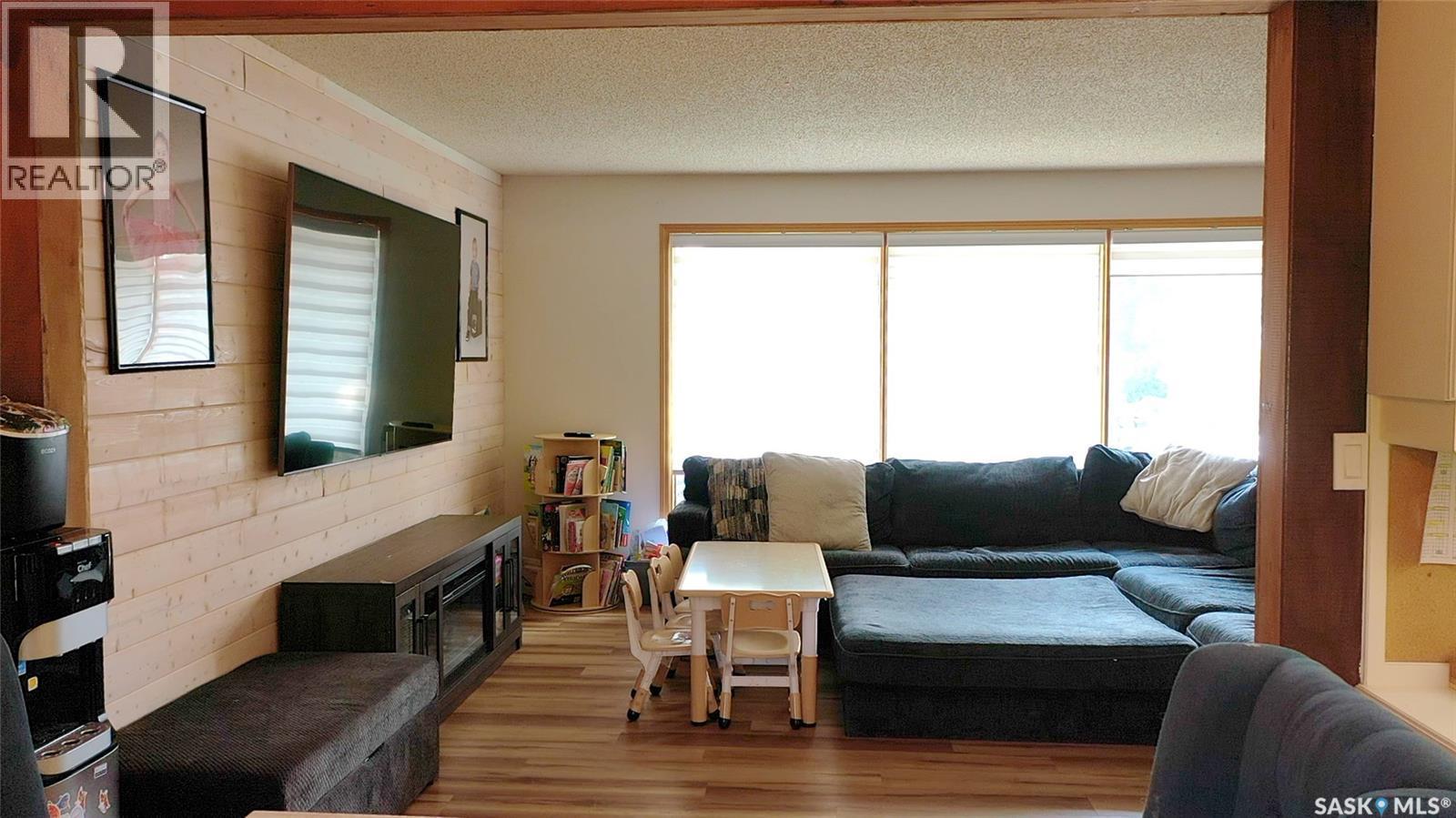 12 Redfield Bay, Yorkton, SK - Indoor Photo Showing Living Room With Fireplace