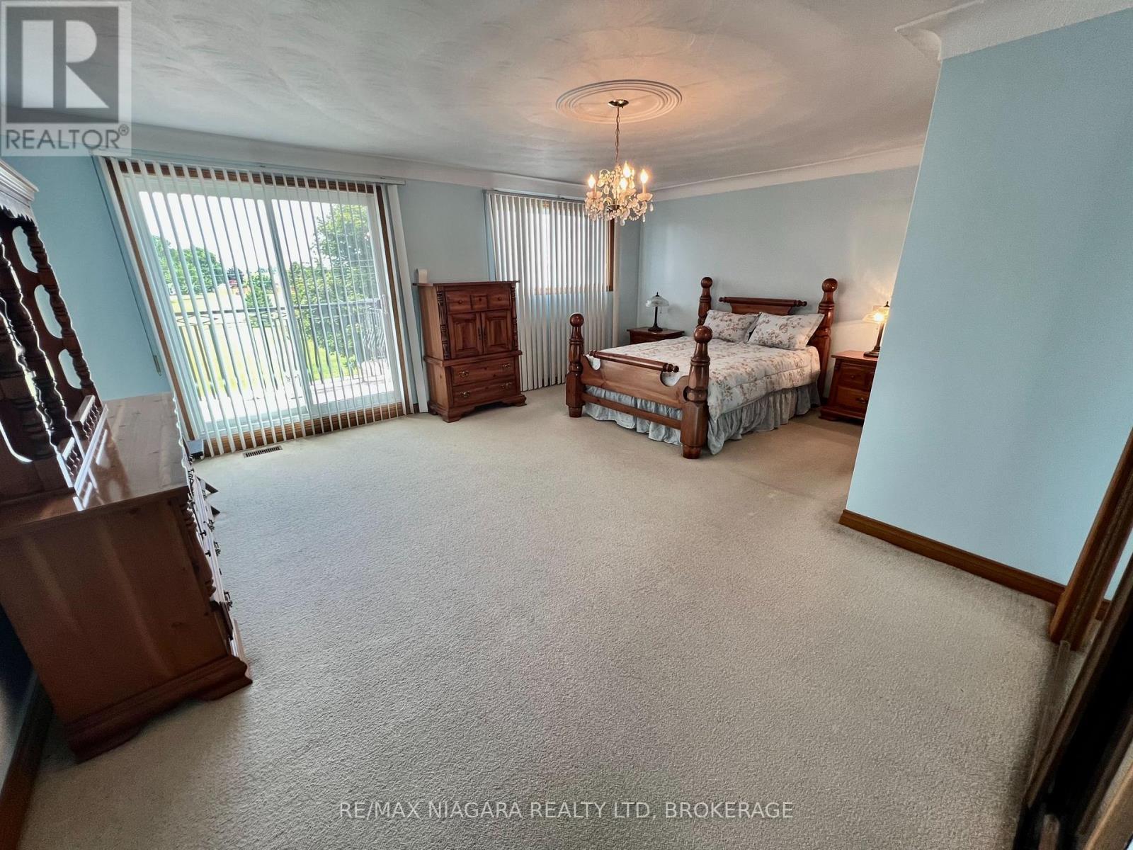 Spacious Master with Glass Patio Doors to Balcony - 4628 Baldwin Avenue, Niagara Falls (Ascot), ON - Indoor Photo Showing Other Room
