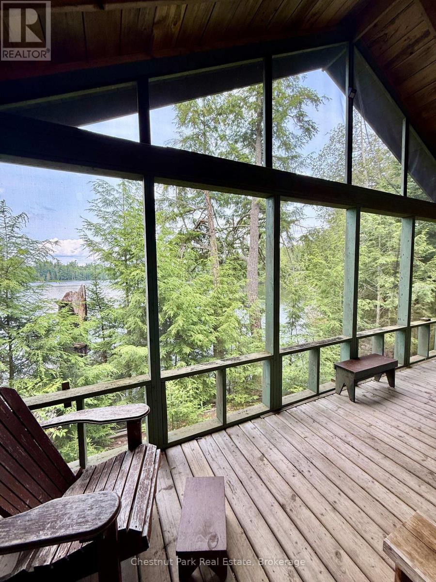 Wide angle of your porch/views over Cache Lake - 50 Cache Lake Apl1322, South Algonquin, ON - Photo Showing Other Room