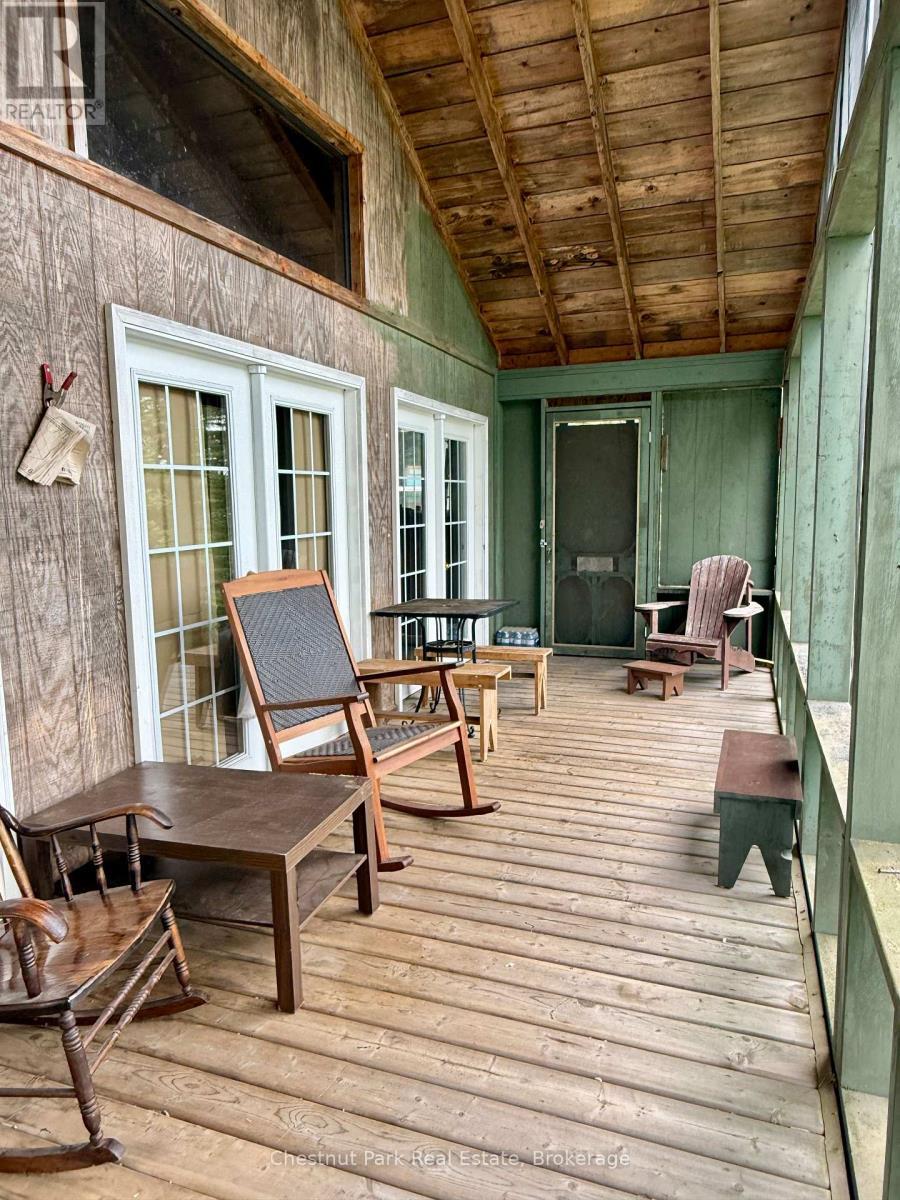 Another porch view. Shutters at far end removable - 50 Cache Lake Apl1322, South Algonquin, ON - Outdoor With Deck Patio Veranda With Exterior