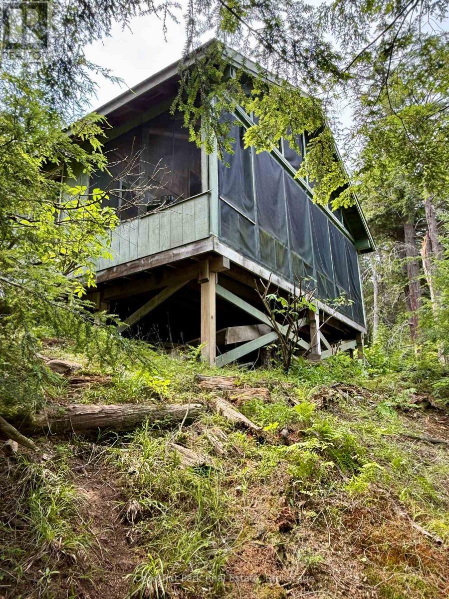 Another view of the main cottage from east side - 50 Cache Lake Apl1322, South Algonquin, ON - Outdoor With Deck Patio Veranda
