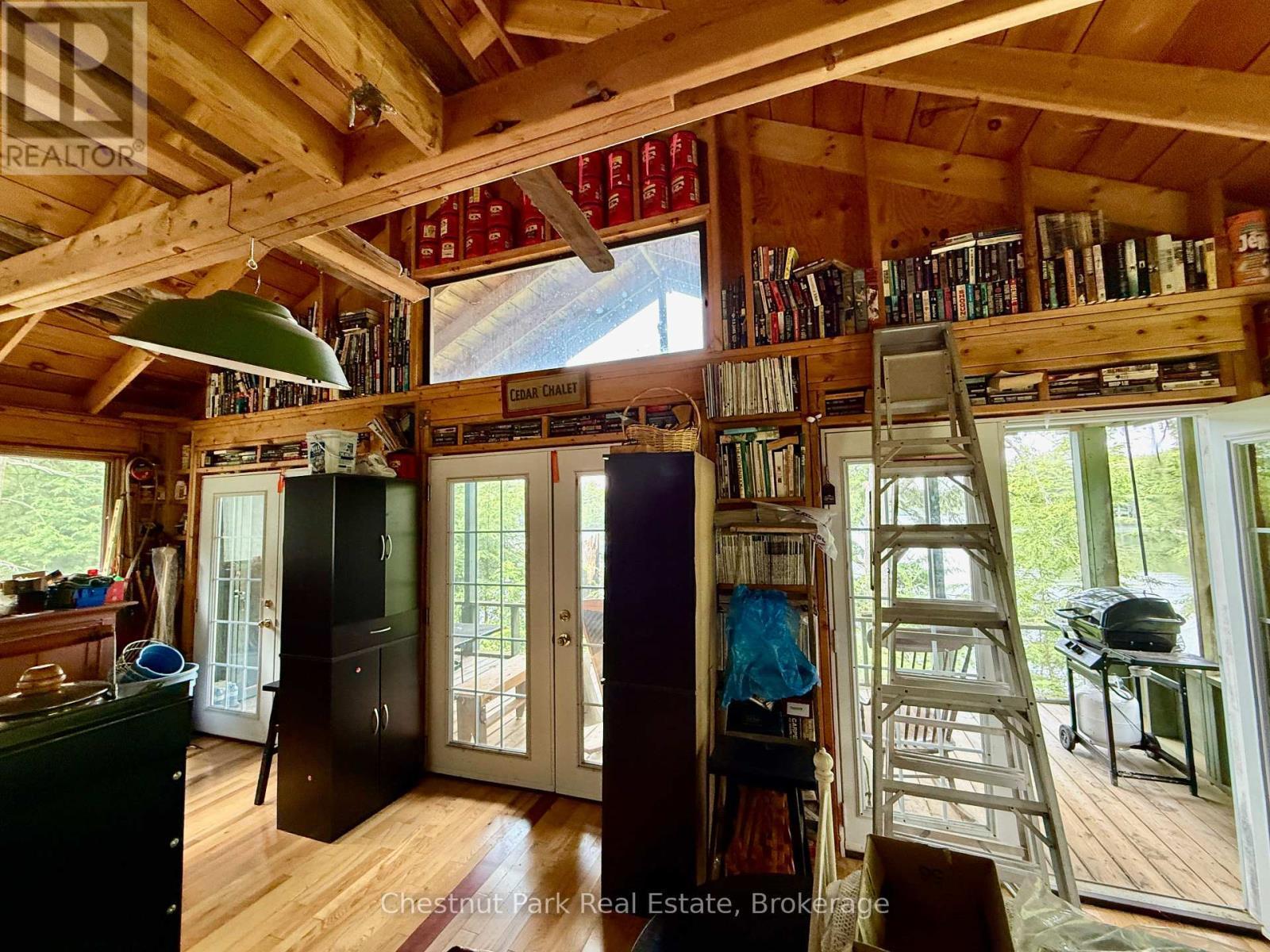 3 French doors to access the porch, breezes/light - 50 Cache Lake Apl1322, South Algonquin, ON - Indoor Photo Showing Other Room
