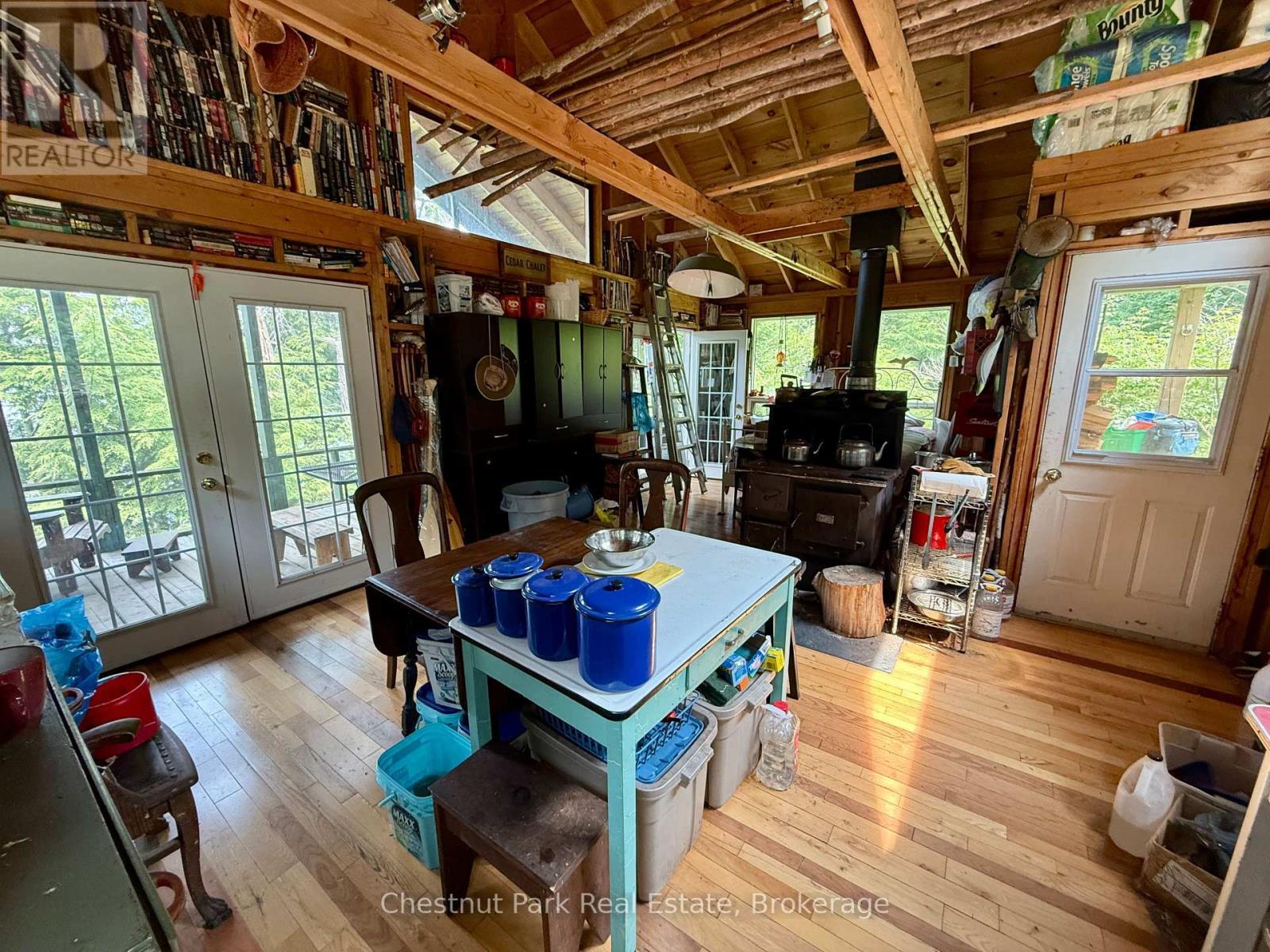 Wide angle of kitchen/dining/entrance - 50 Cache Lake Apl1322, South Algonquin, ON - Indoor Photo Showing Other Room