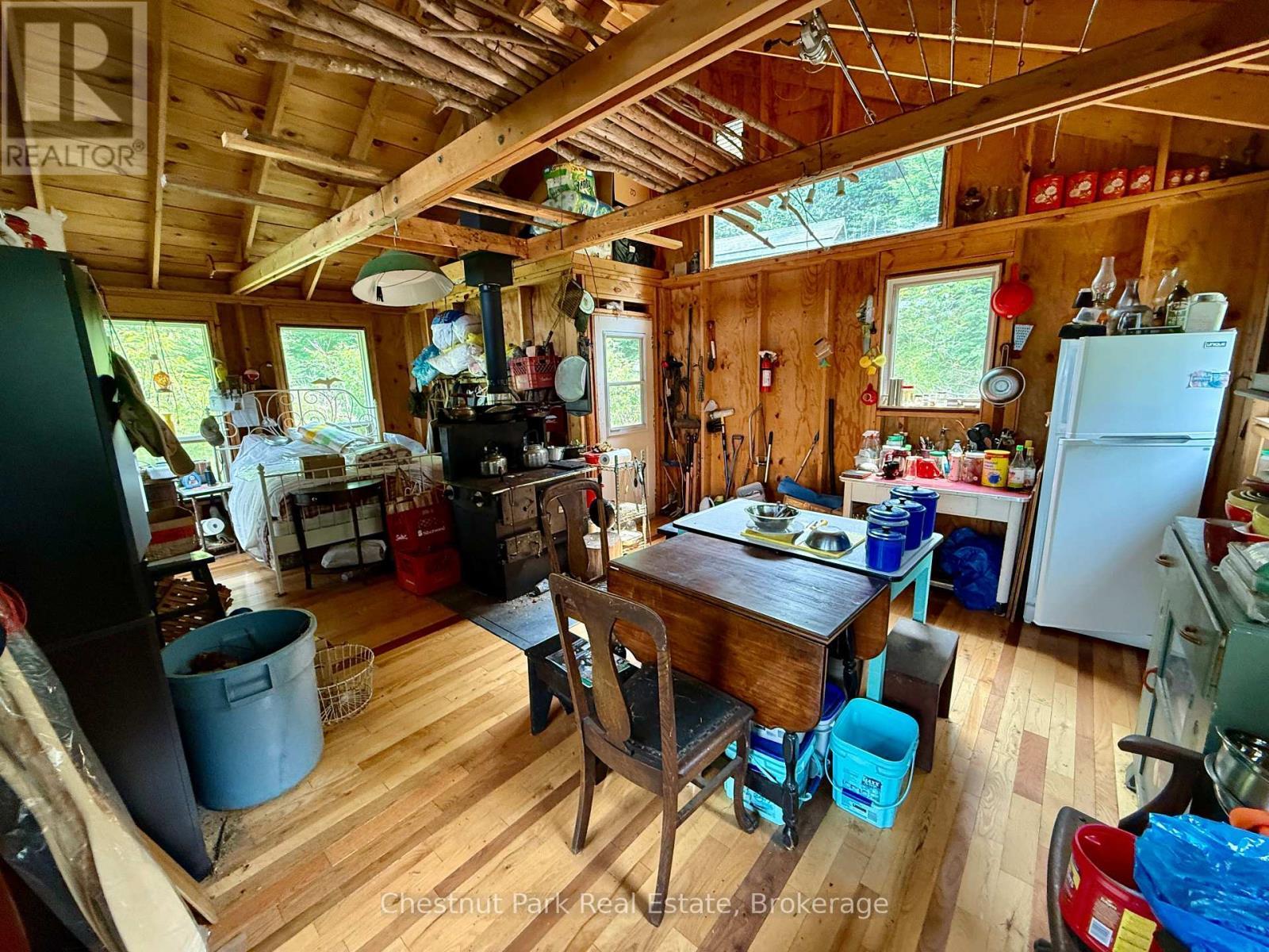 Wide angle of kitchen/dining/entrance - 50 Cache Lake Apl1322, South Algonquin, ON - Indoor
