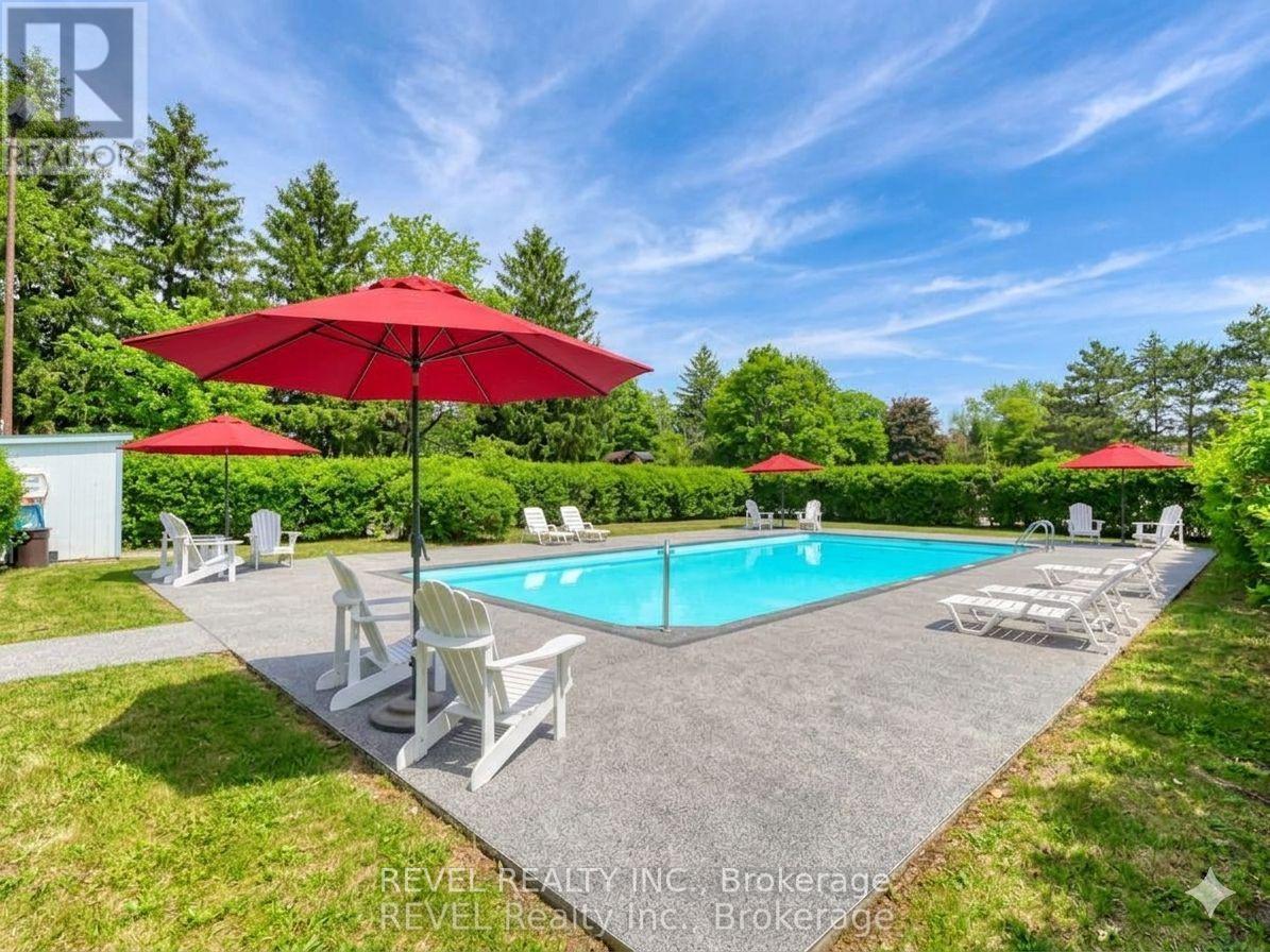 407 - 359 Geneva Street S, St. Catharines, ON - Outdoor With In Ground Pool With Backyard