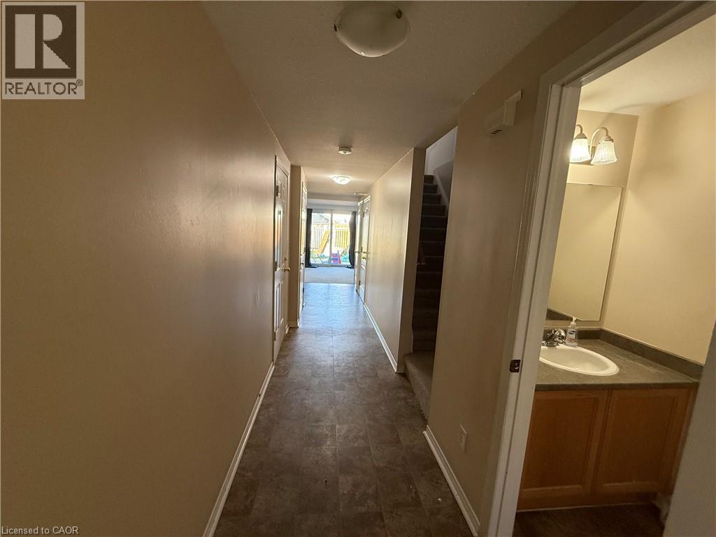 Hallway featuring neutral wall tones and wood-finish flooring - 11 Hackberry Street Unit# 1, Kitchener, ON - Indoor Photo Showing Other Room