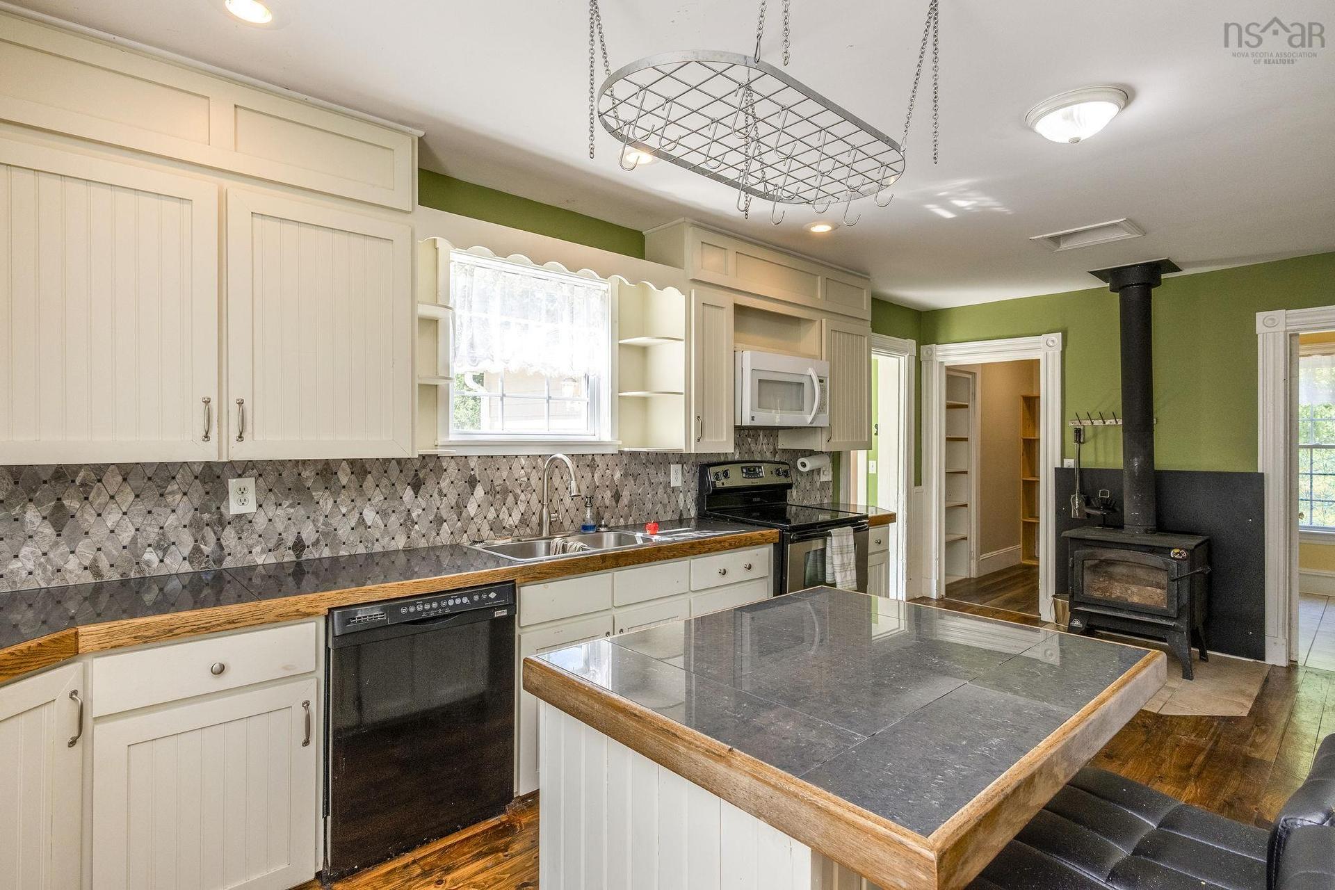 4902 Highway 1, Waterville, NS - Indoor Photo Showing Kitchen With Fireplace With Double Sink