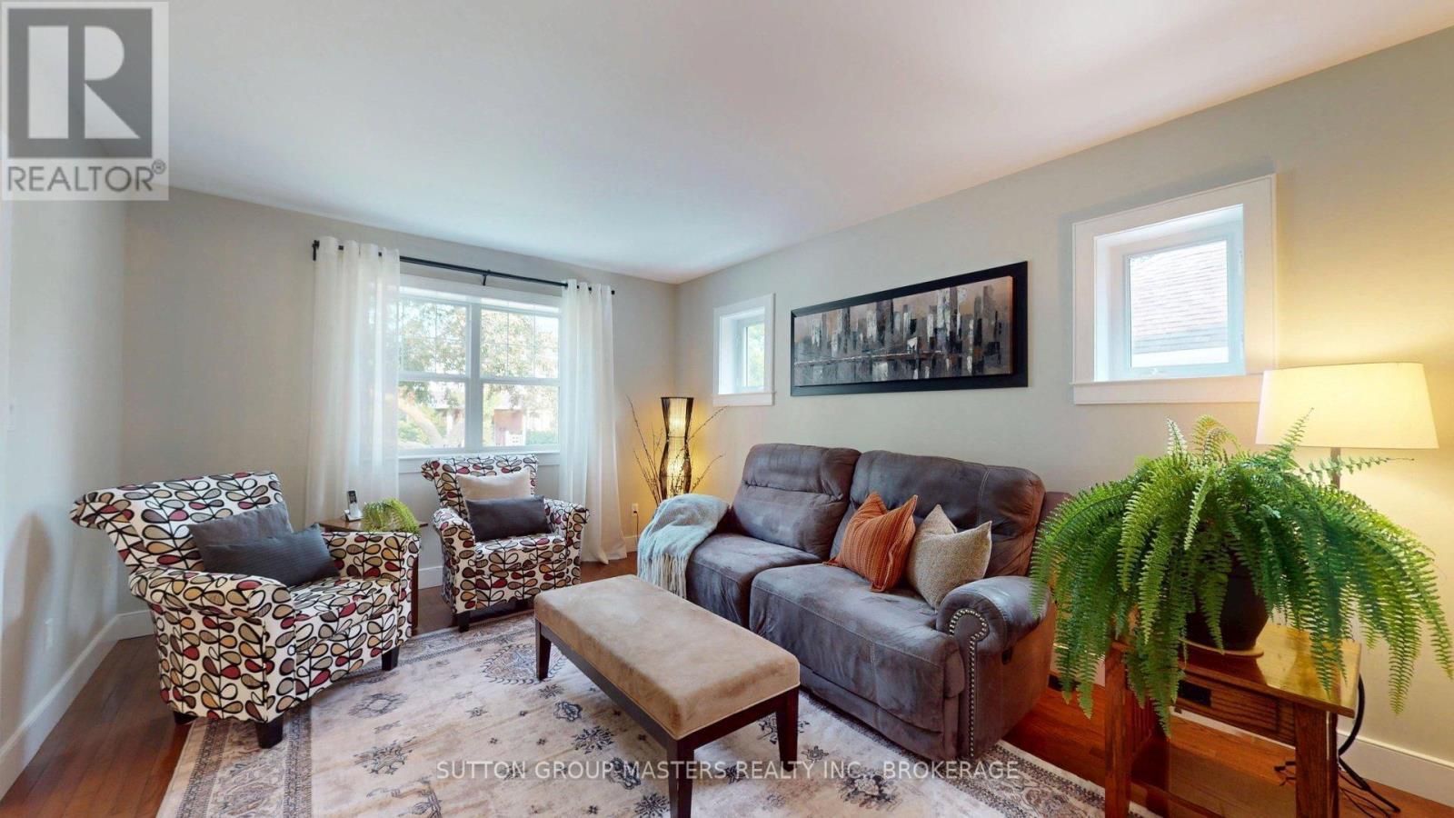 lovely living room with windows on two sides - 160 Napier Street, Kingston (Central City East), ON - Indoor Photo Showing Living Room
