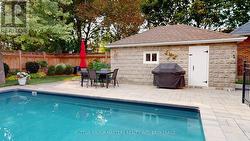stone facade of garage makes a nice BBQ backdrop! -