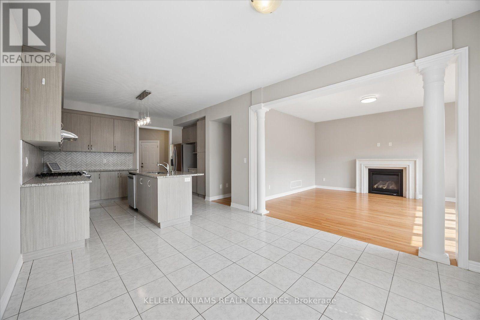 668 Mcgregor Farm Trail, Newmarket, ON - Indoor Photo Showing Kitchen With Fireplace