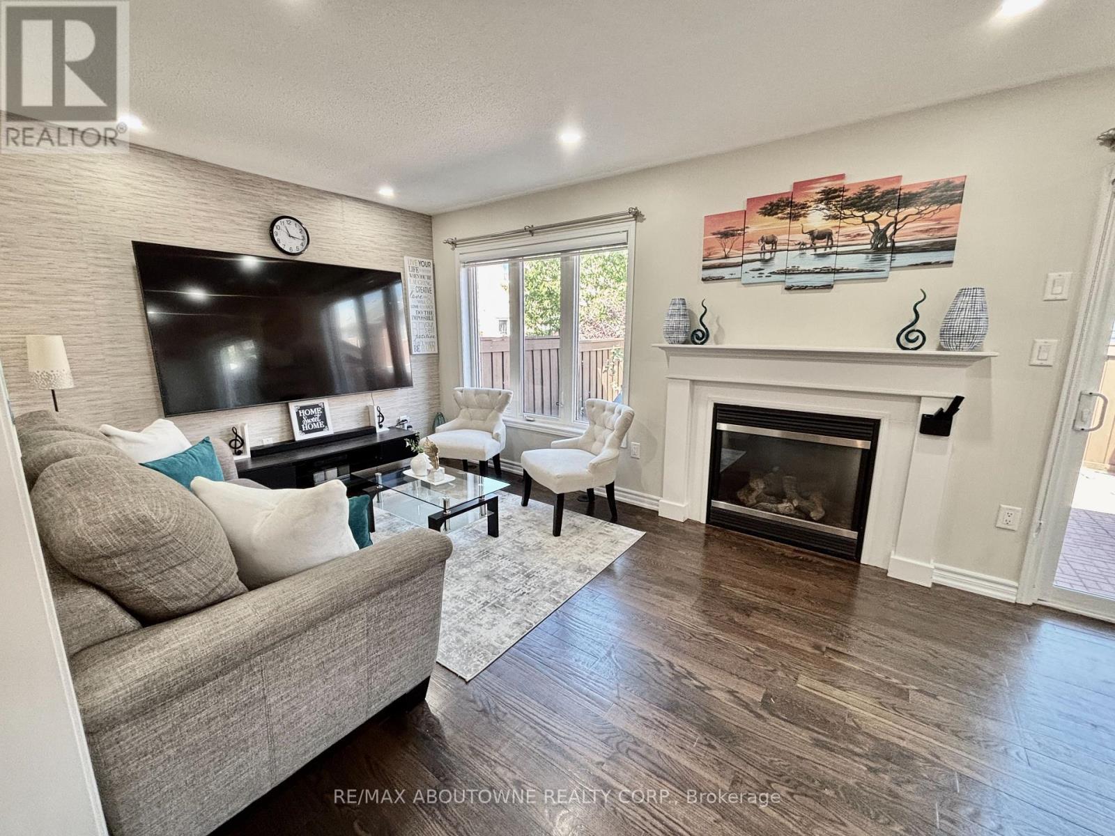 36 Van Fleet Terrace, Milton, ON - Indoor Photo Showing Living Room With Fireplace