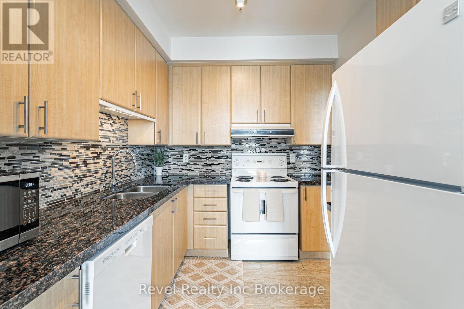 515 - 80 Port Street E, Mississauga (Port Credit), ON - Indoor Photo Showing Kitchen With Double Sink
