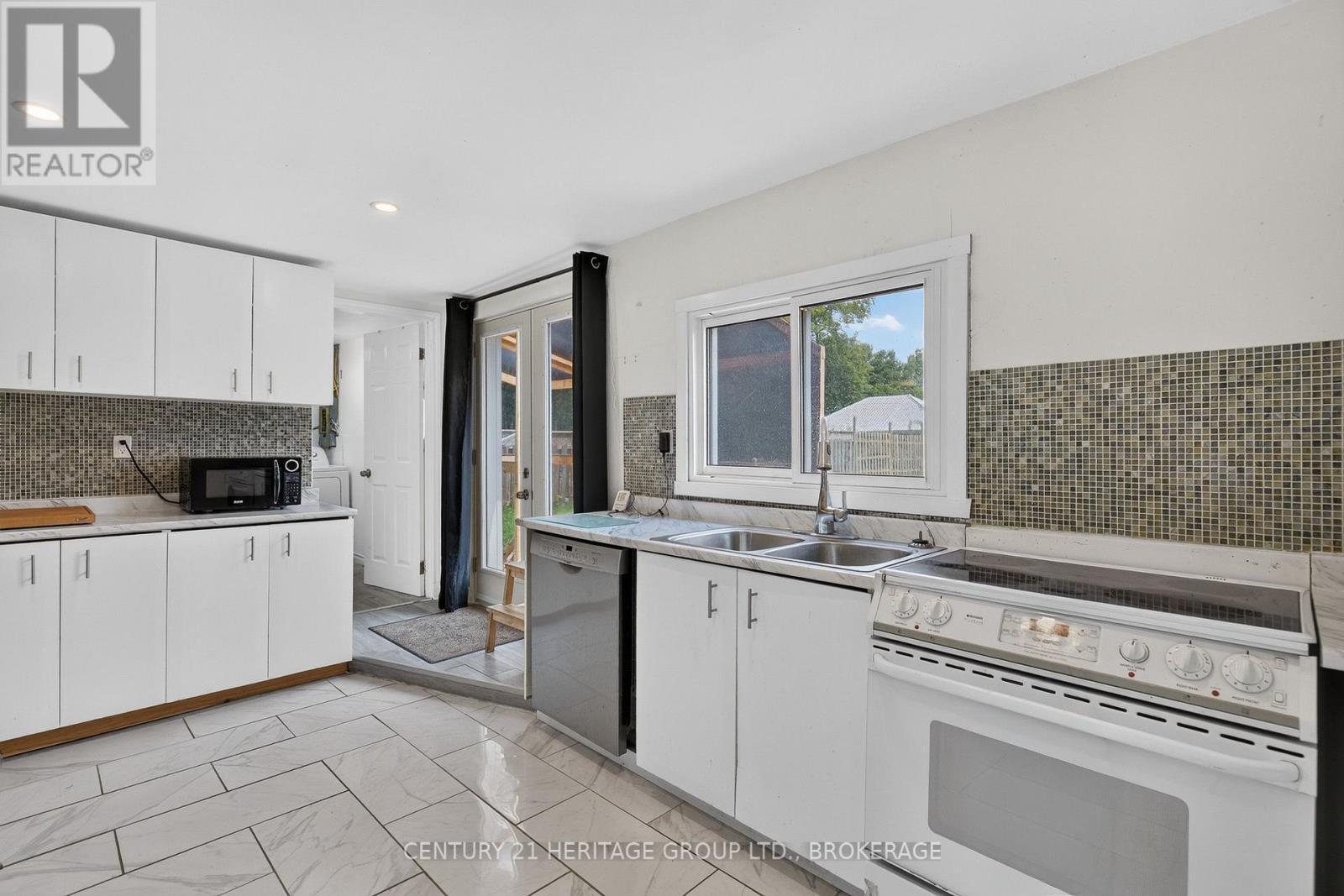 6756 Hwy 38 Highway, Frontenac (Frontenac South), ON - Indoor Photo Showing Kitchen With Double Sink