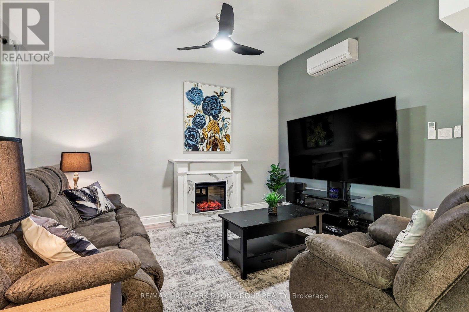 295 - 308 Masters Lane, Clarence-Rockland, ON - Indoor Photo Showing Living Room With Fireplace