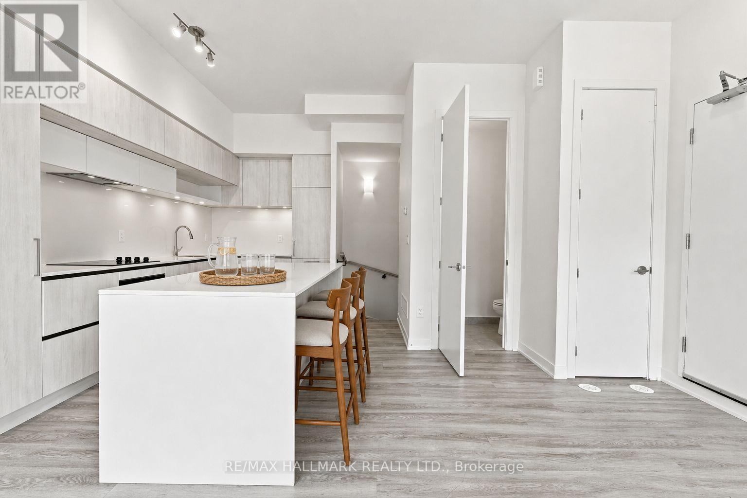 Kitchen with Powder Room and Downstairs Entrance - 1508 - 11 David Eyer Road, Richmond Hill, ON - Indoor Photo Showing Kitchen