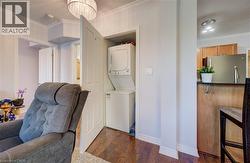 Laundry closet with stacked washer and dryer -