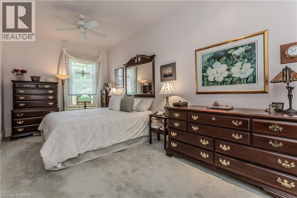 Wall-to-wall carpeting and neutral wall tones define this interior space - 569 Locust Street, Burlington, ON - Indoor Photo Showing Bedroom