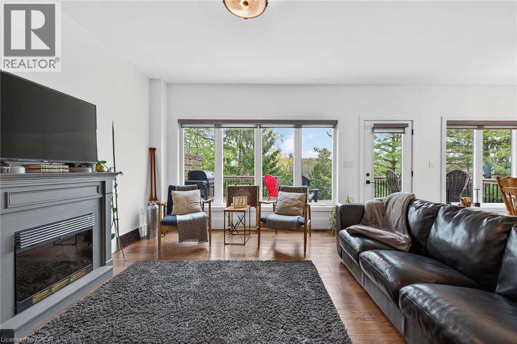 1300 River Road, Cayuga, ON - Indoor Photo Showing Living Room With Fireplace