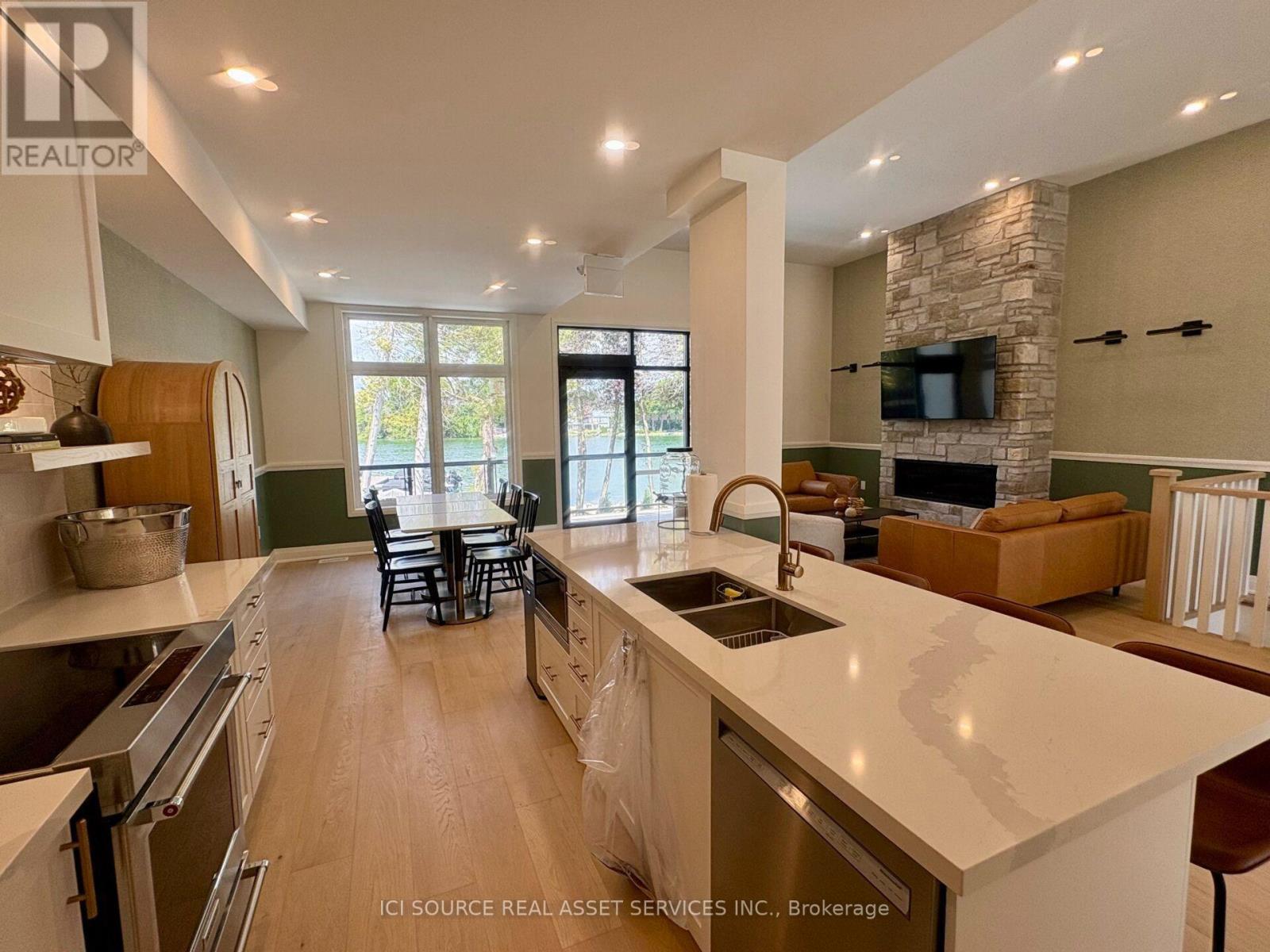 44 Ruby Crescent, Orillia, ON - Indoor Photo Showing Kitchen With Fireplace With Double Sink With Upgraded Kitchen