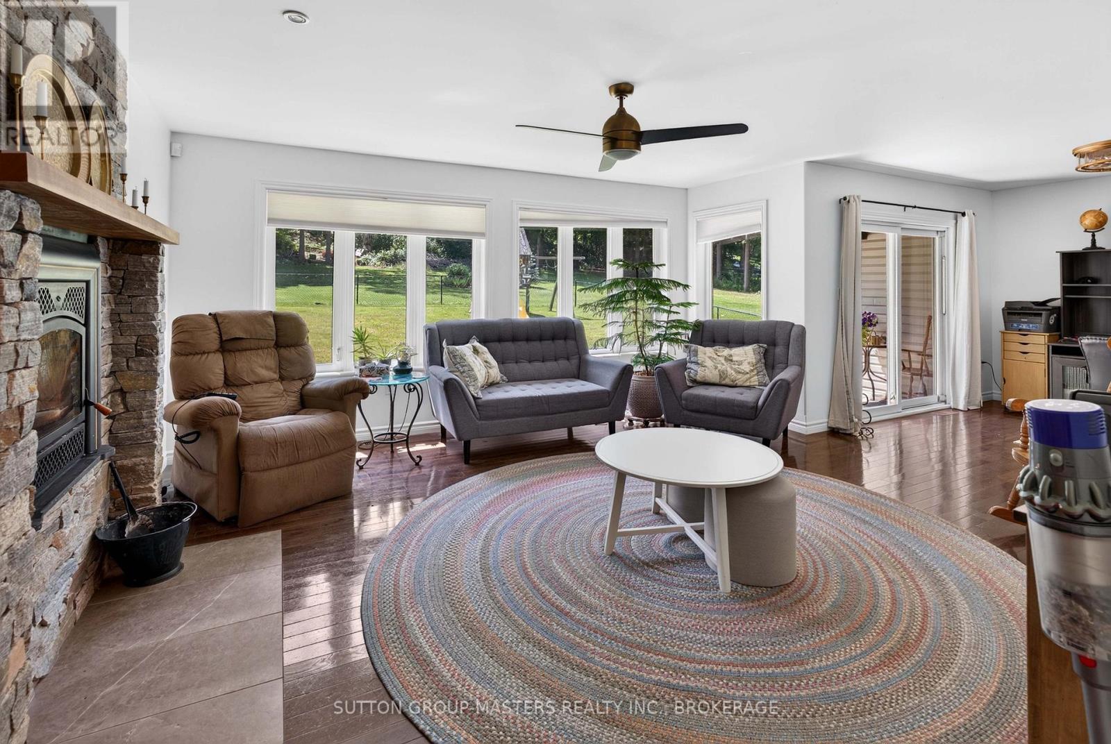 710 Maple Road, Loyalist (Lennox And Addington - South), ON - Indoor Photo Showing Living Room With Fireplace