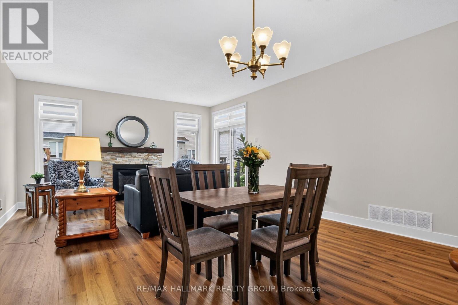 75 Sable Run Drive, Ottawa, ON - Indoor Photo Showing Dining Room With Fireplace