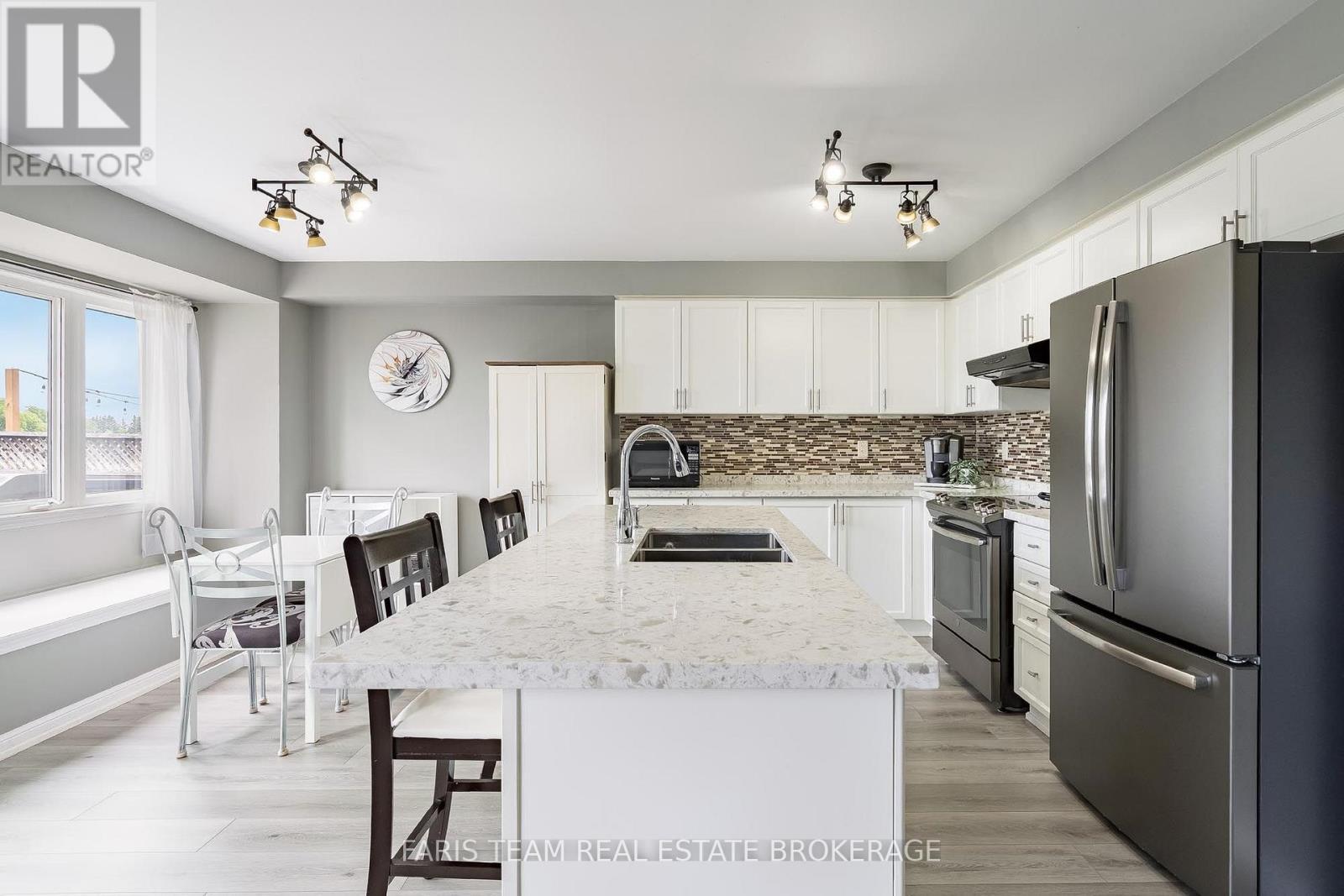 64 John W Taylor Avenue, New Tecumseth, ON - Indoor Photo Showing Kitchen With Double Sink With Upgraded Kitchen