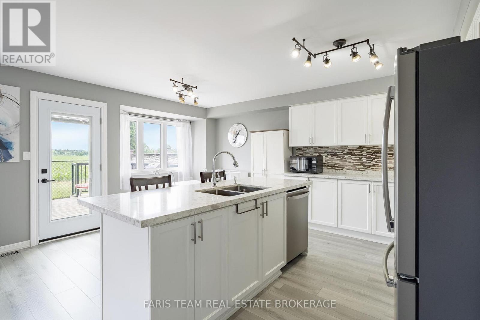 64 John W Taylor Avenue, New Tecumseth, ON - Indoor Photo Showing Kitchen With Double Sink