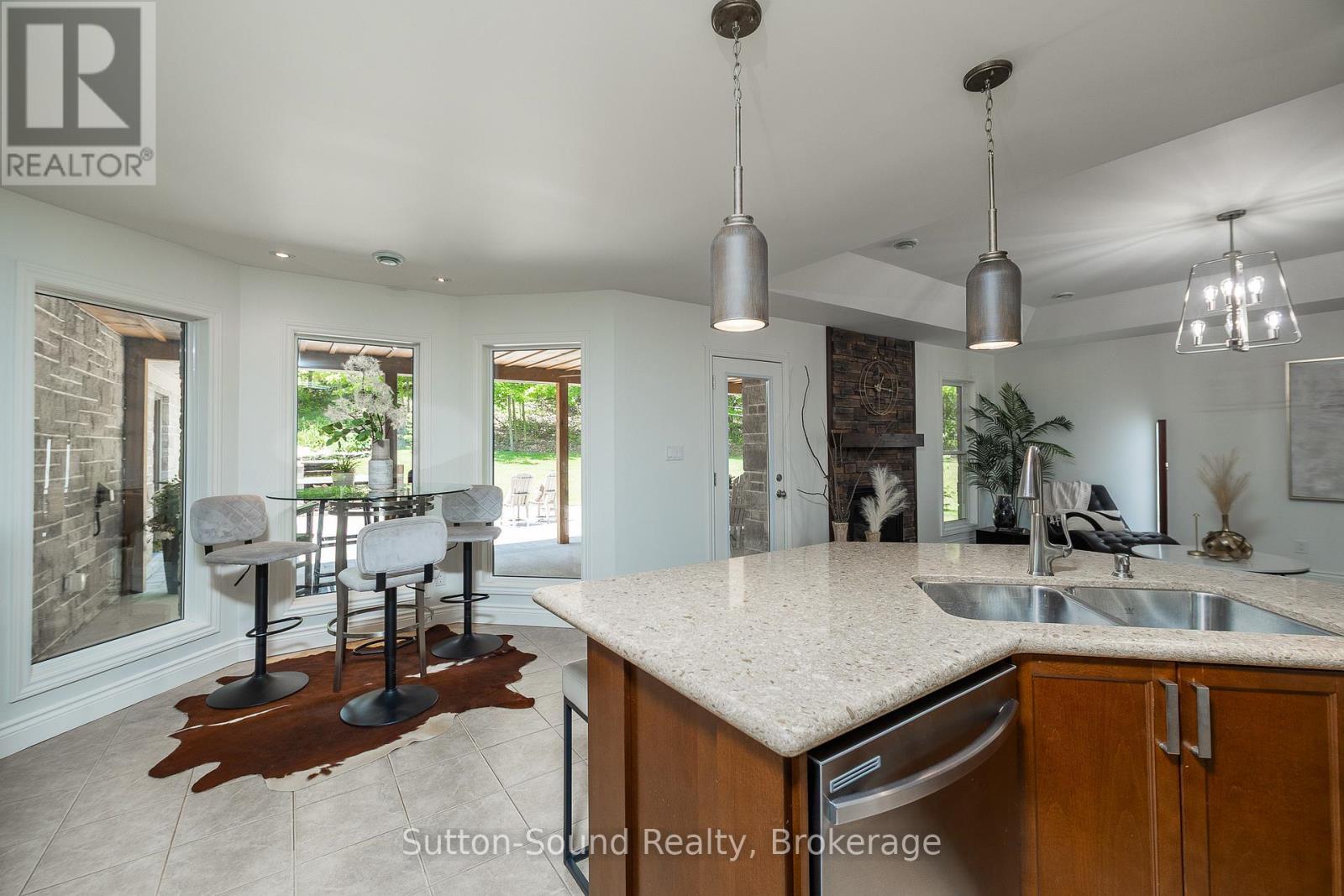 Kitchen nook and peninsula with Granite - 505556 Grey Road 1 Road, Georgian Bluffs, ON - Indoor