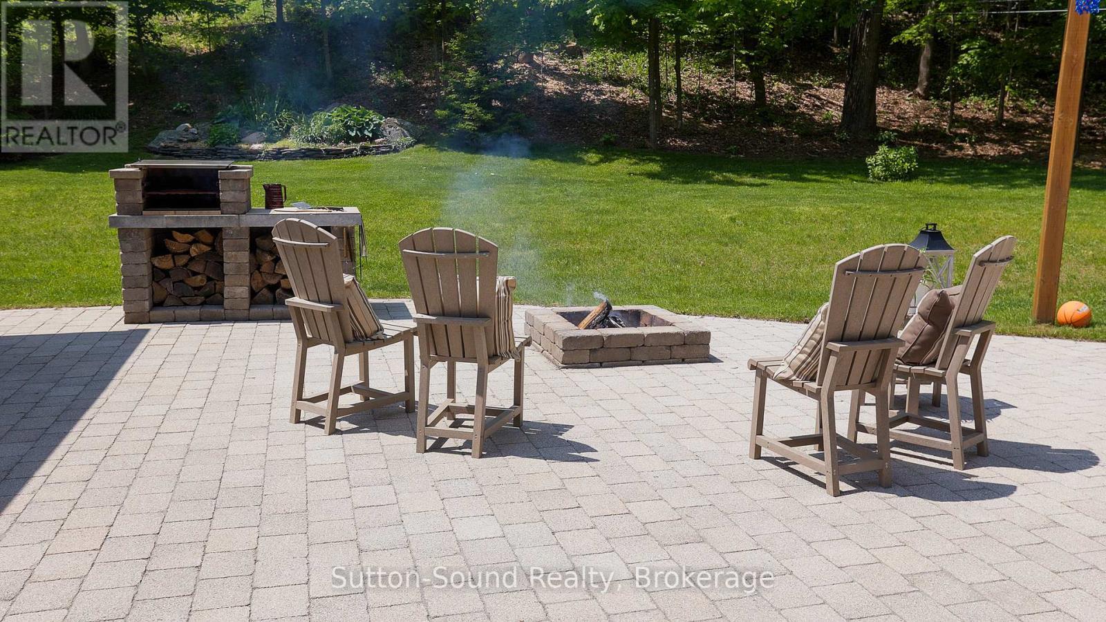 Stone Patio behind Primary Res - 505556 Grey Road 1 Road, Georgian Bluffs, ON - Outdoor With Deck Patio Veranda