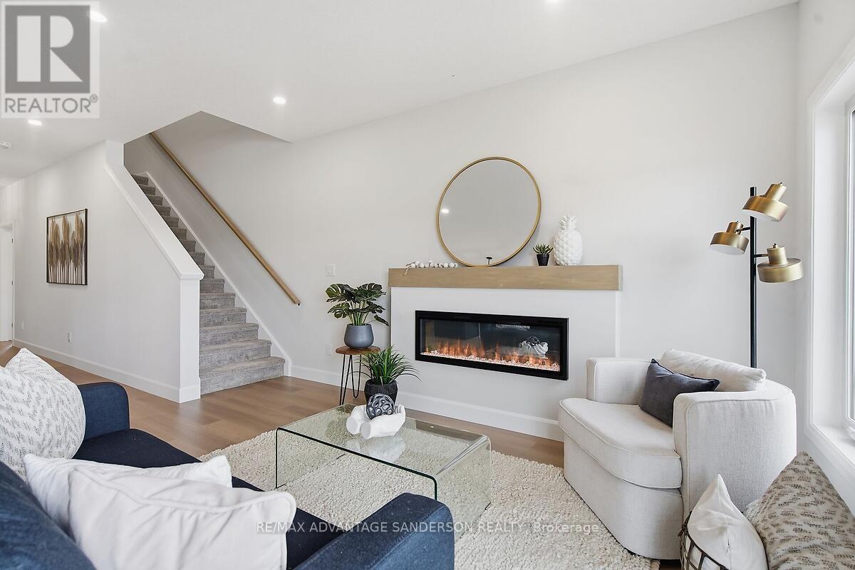 165 Bowman Drive, Middlesex Centre (Ilderton), ON - Indoor Photo Showing Living Room With Fireplace