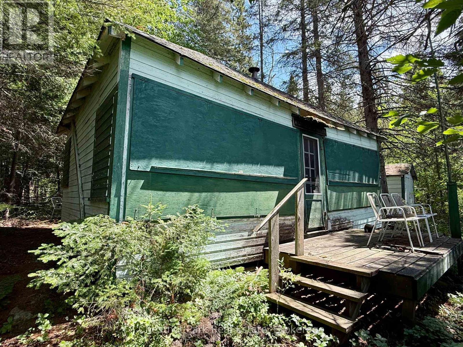 Lakeside of cottage with shutters on - 17 Whitefish Lake Apl1582, Algonquin Highlands (Lawrence), ON - Outdoor