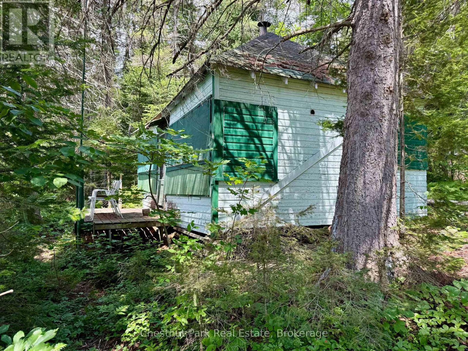 Dryland boathouse sits at the shore - 17 Whitefish Lake Apl1582, Algonquin Highlands (Lawrence), ON - Outdoor