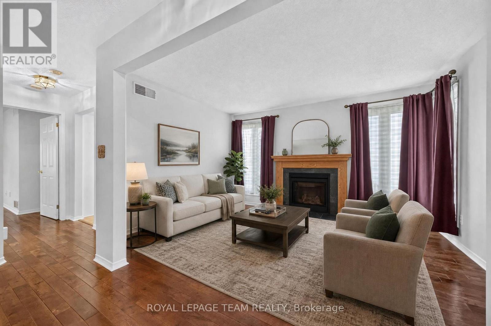 35 Billingham Crescent, Ottawa, ON - Indoor Photo Showing Living Room With Fireplace