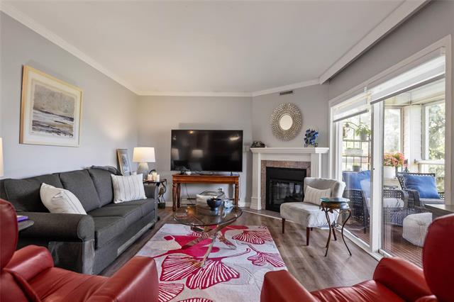 307-70 Dunkirk Dr, Winnipeg, MB - Indoor Photo Showing Living Room With Fireplace