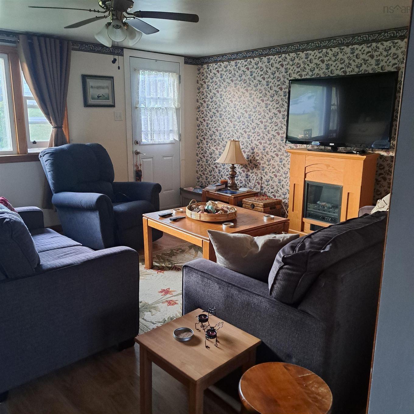 4540 Highway 2, Upper Economy, NS - Indoor Photo Showing Living Room With Fireplace