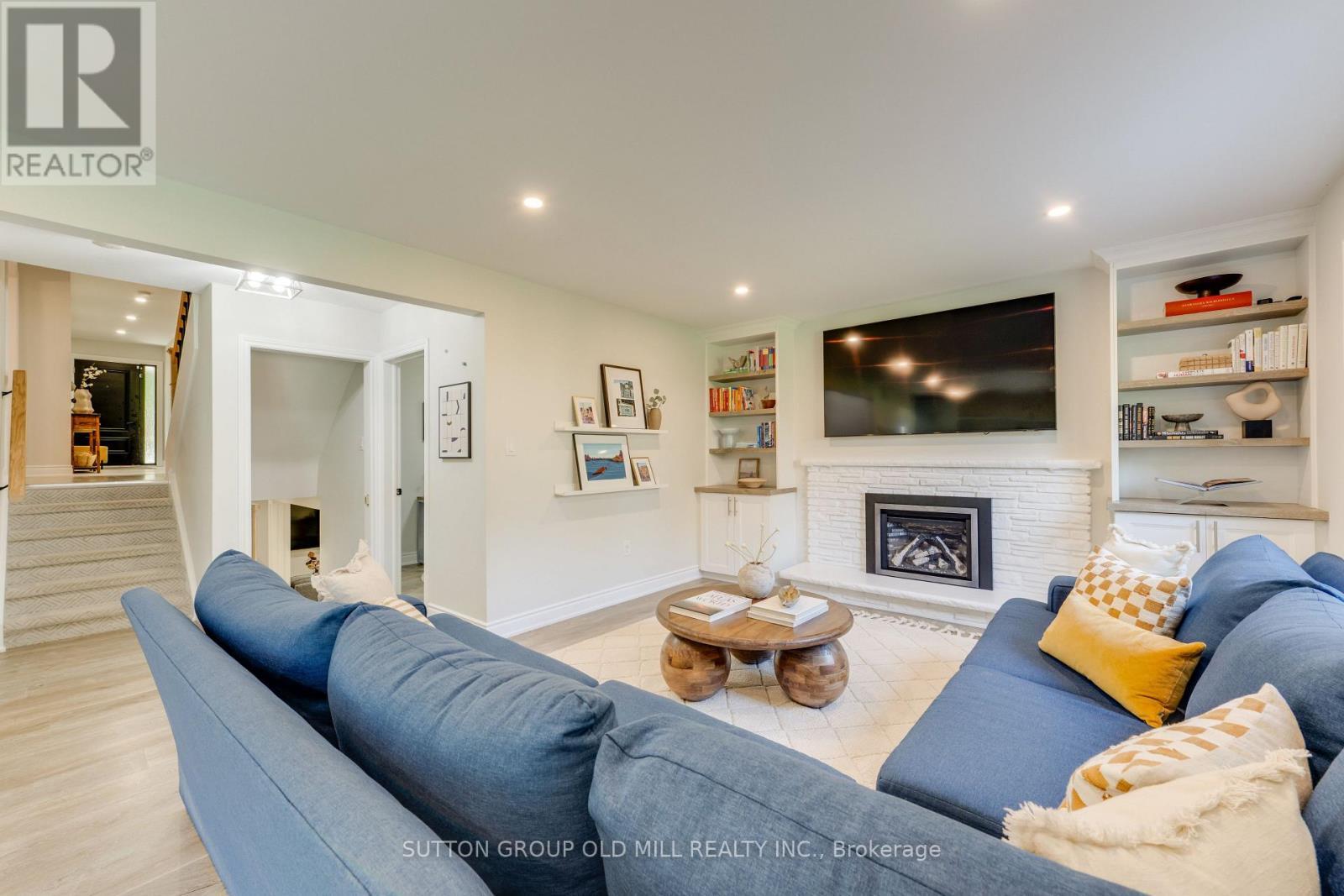 Ground floor family room w. walk-out to yard - 85 Bonnyview Drive, Toronto, ON - Indoor Photo Showing Living Room With Fireplace