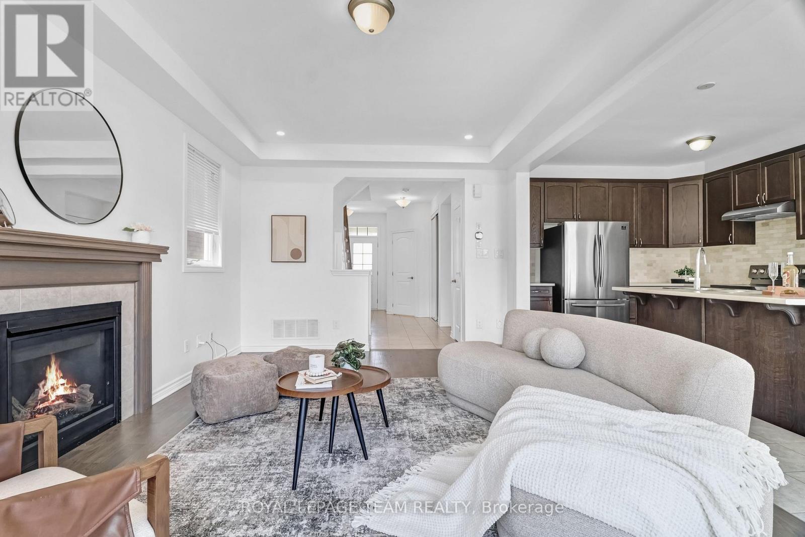 4852 Abbott Street E, Ottawa, ON - Indoor Photo Showing Living Room With Fireplace