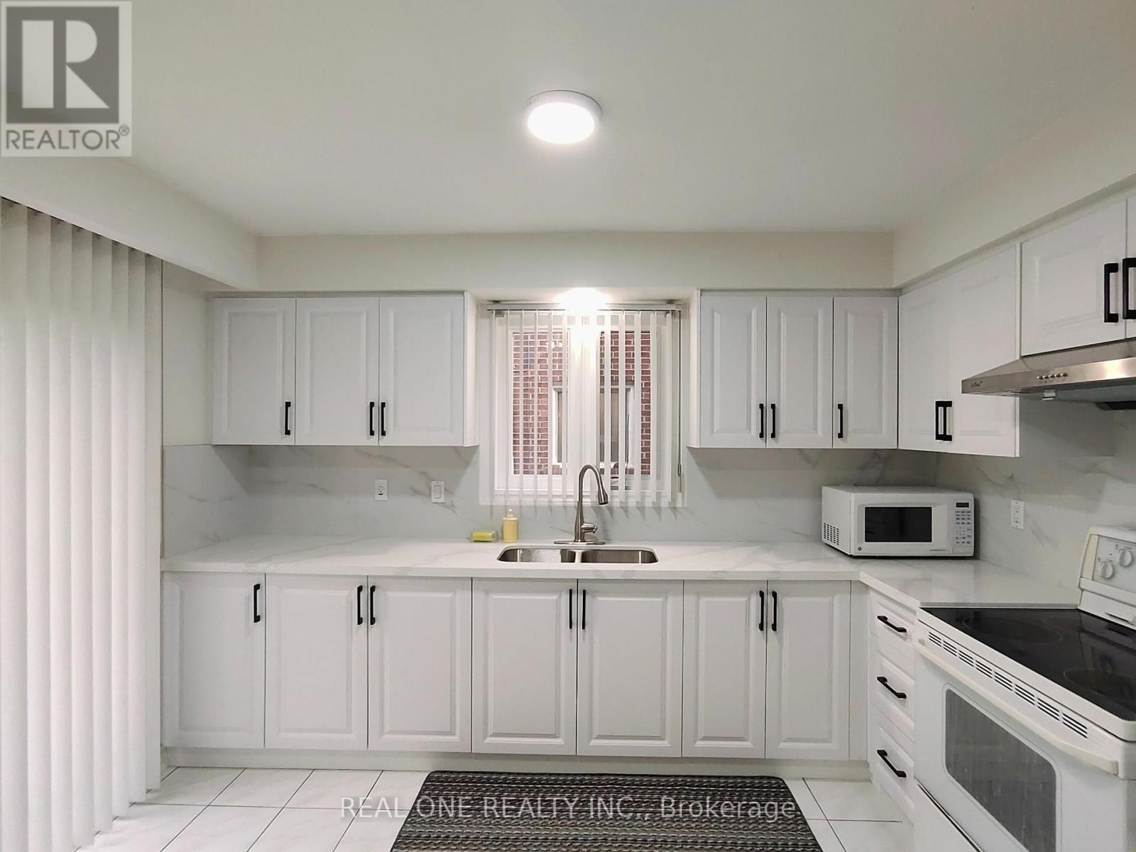 13 Mallaby Road, Toronto, ON - Indoor Photo Showing Kitchen With Double Sink