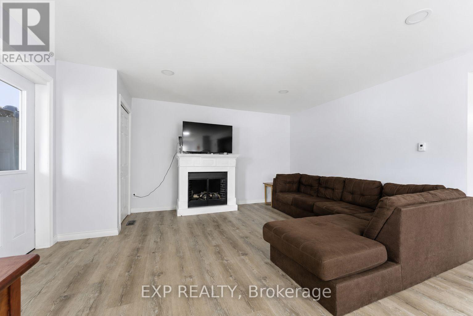 Unit 1 - Living room - 23B Mother'S Road, Tweed (Elzevir (Twp)), ON - Indoor Photo Showing Living Room With Fireplace