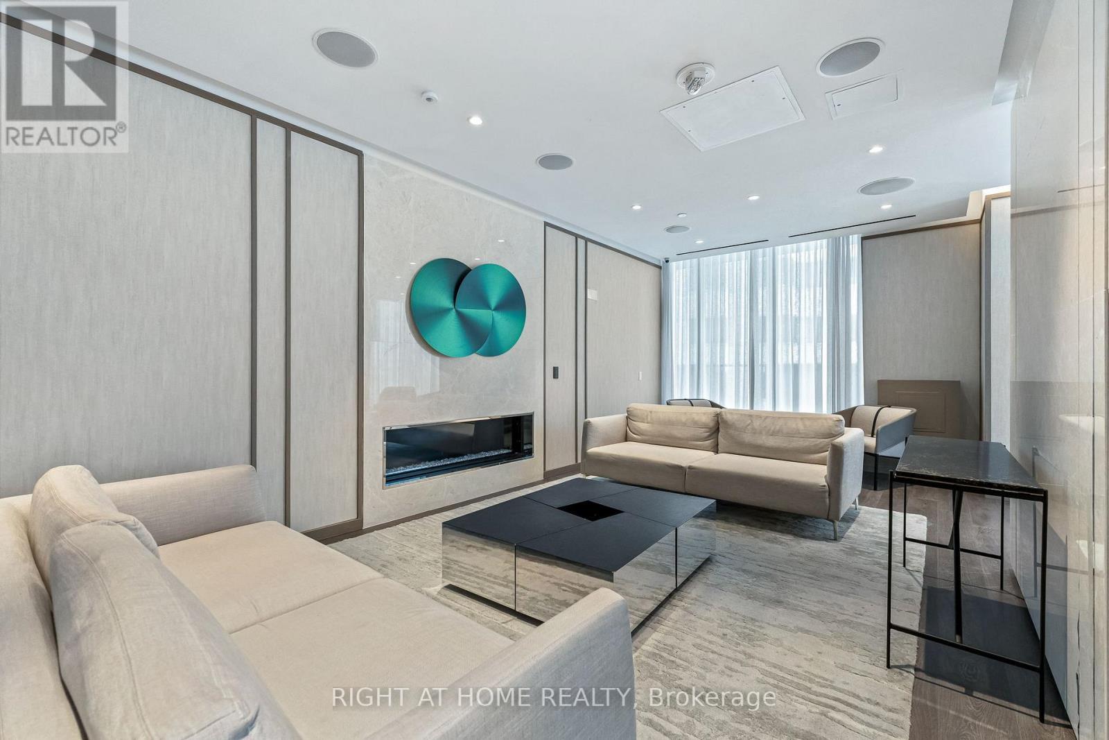 3110 - 115 Blue Jays Way, Toronto, ON - Indoor Photo Showing Living Room With Fireplace