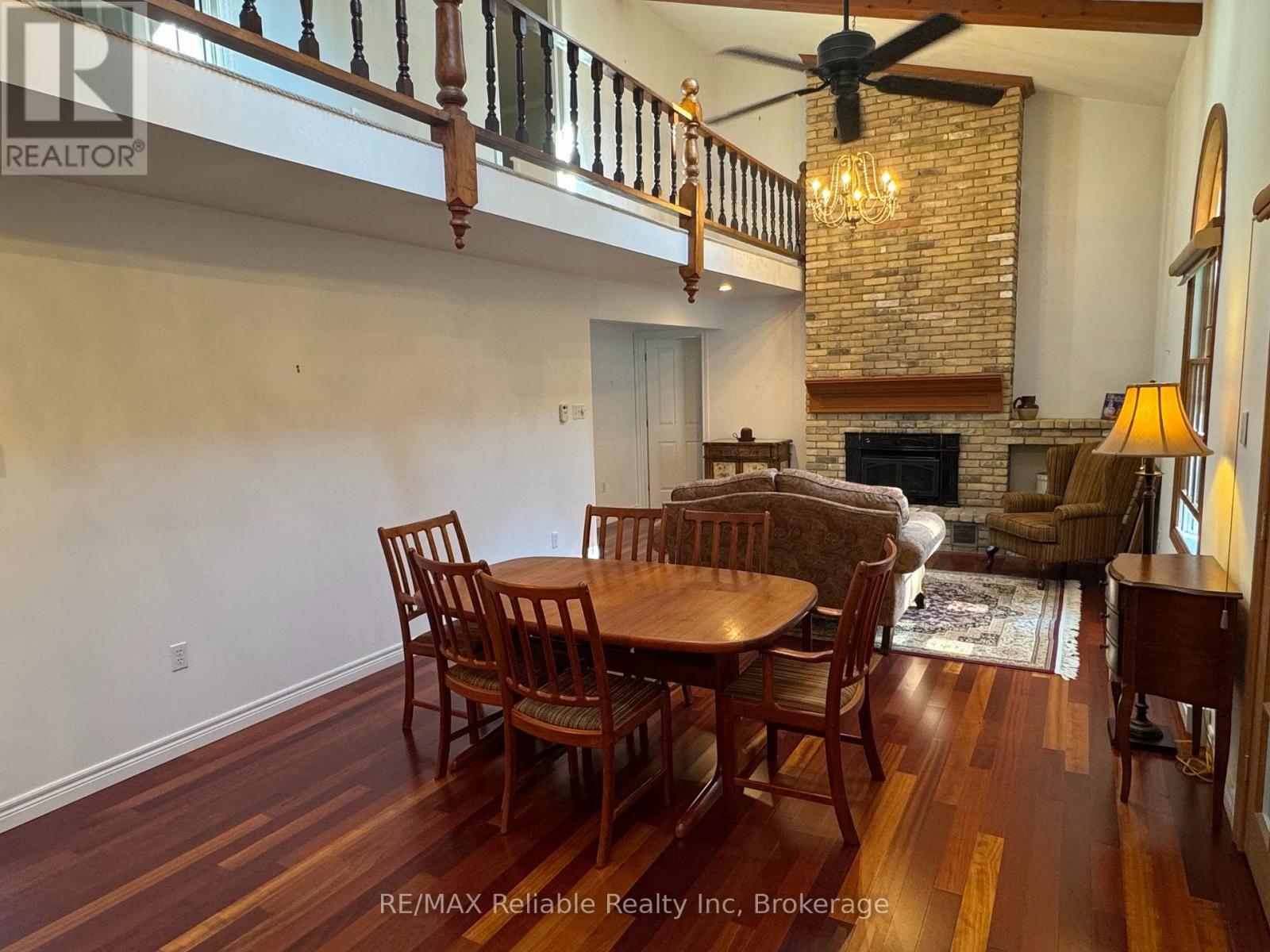 60 Tuyll Street, Bluewater (Bayfield), ON - Indoor Photo Showing Dining Room With Fireplace