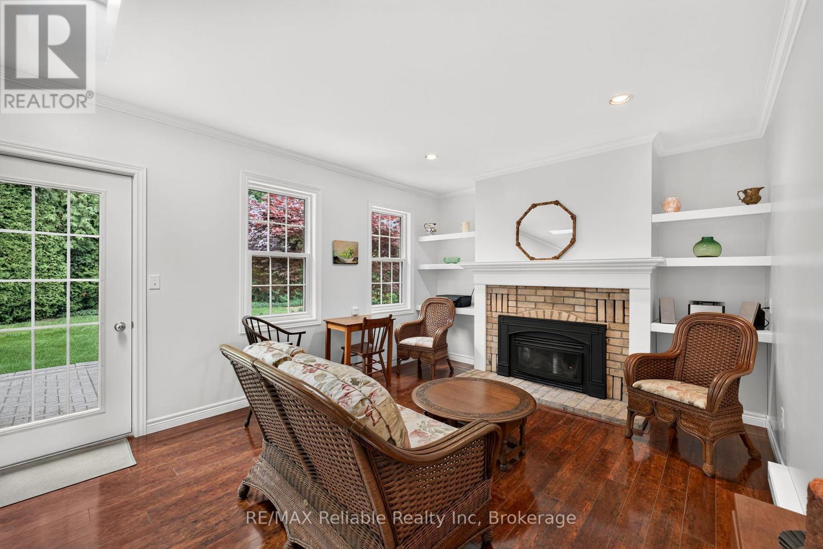 Gas fireplace in family room - 60 Tuyll Street, Bluewater (Bayfield), ON - Indoor Photo Showing Living Room With Fireplace