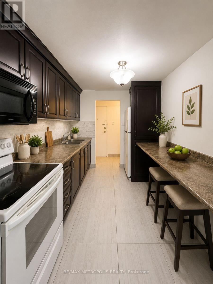 202 - 1445 Wilson Avenue, Toronto, ON - Indoor Photo Showing Kitchen With Double Sink