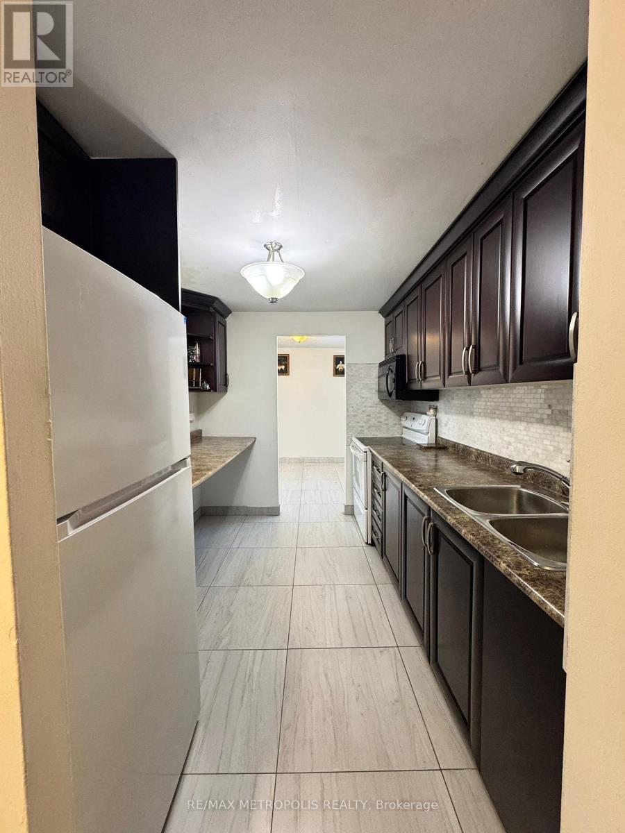202 - 1445 Wilson Avenue, Toronto, ON - Indoor Photo Showing Kitchen With Double Sink