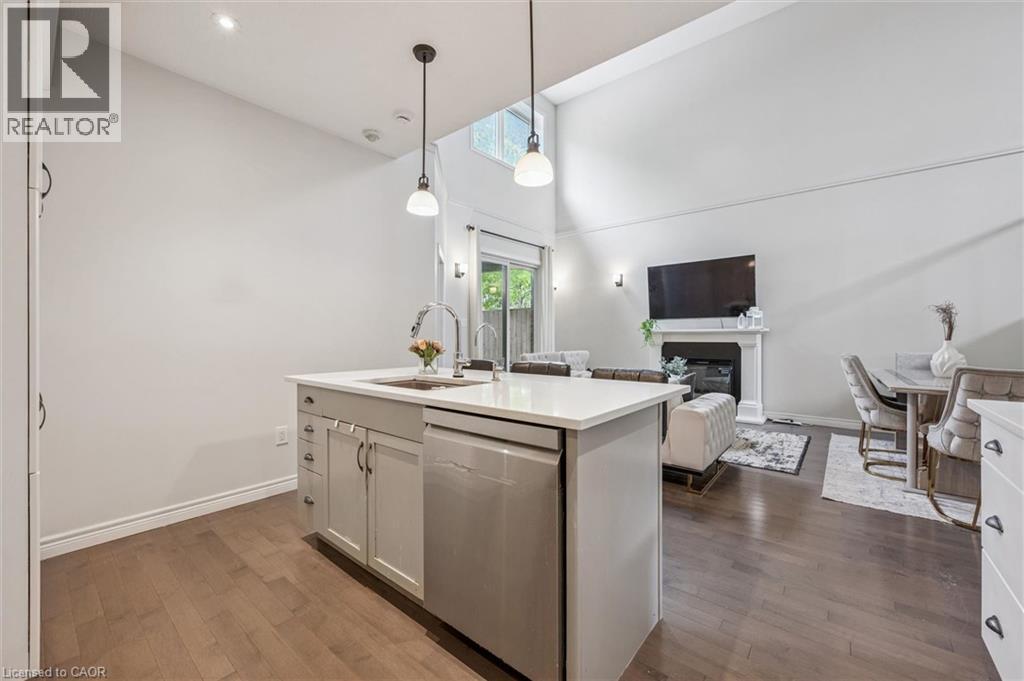 254 Gosling Gardens Unit# 12, Guelph, ON - Indoor Photo Showing Kitchen With Fireplace