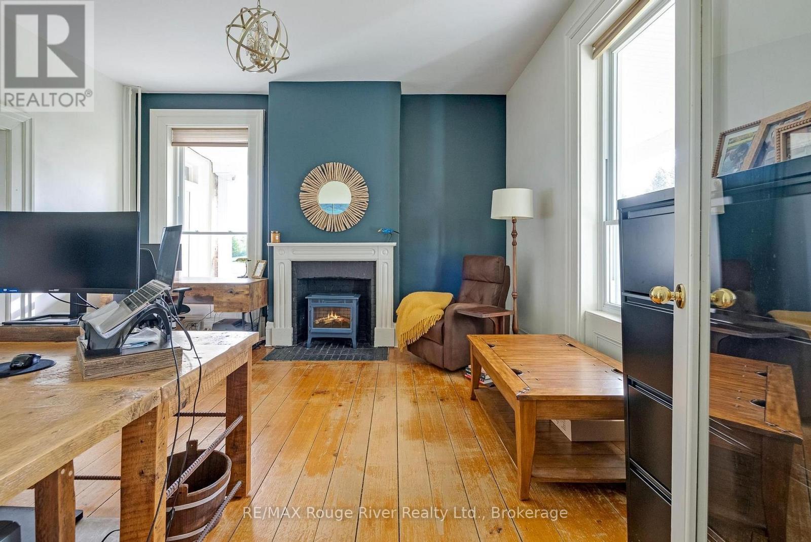 733 County Rd 2 Rd Road E, Otonabee-South Monaghan, ON - Indoor Photo Showing Other Room With Fireplace