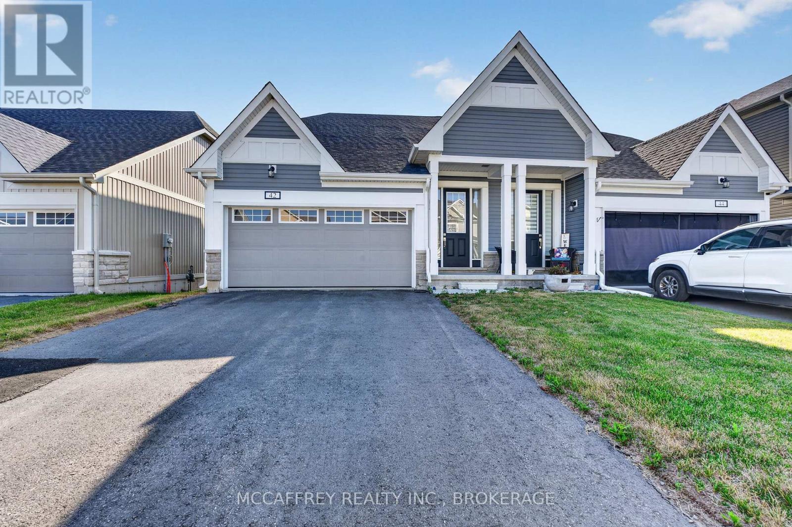 42 Golf Links Drive, Loyalist (Bath), ON - Outdoor With Facade