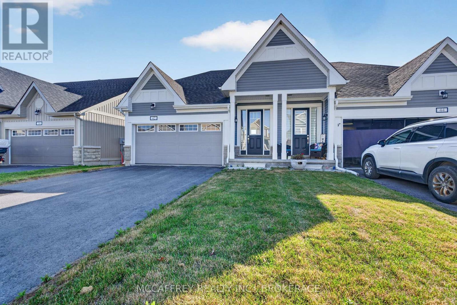 42 Golf Links Drive, Loyalist (Bath), ON - Outdoor With Facade