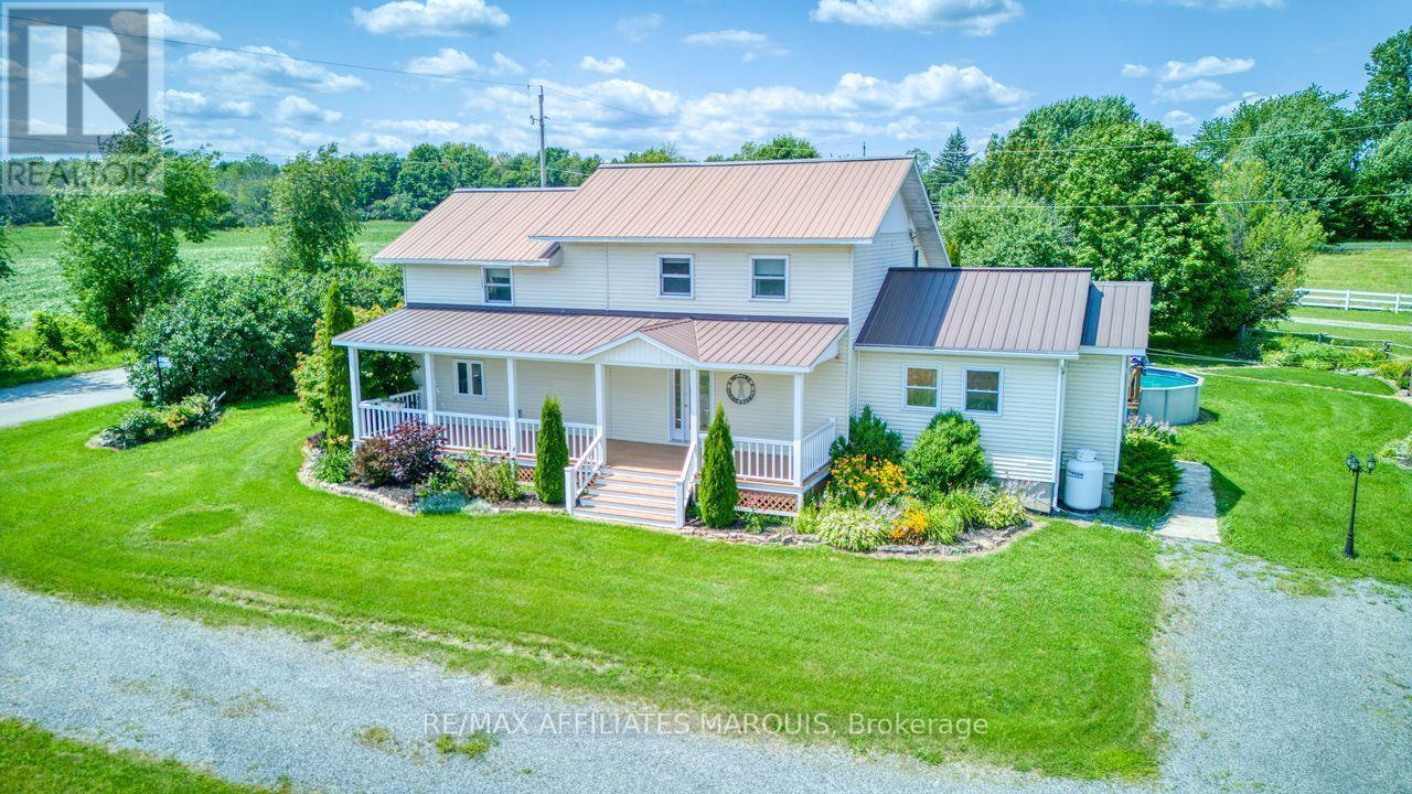 metal roof and large decks on front and back! - 421 Summers Road, Rideau Lakes, ON - Outdoor With Deck Patio Veranda