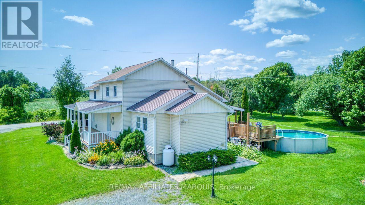 look at those gardens! - 421 Summers Road, Rideau Lakes, ON - Outdoor With Above Ground Pool